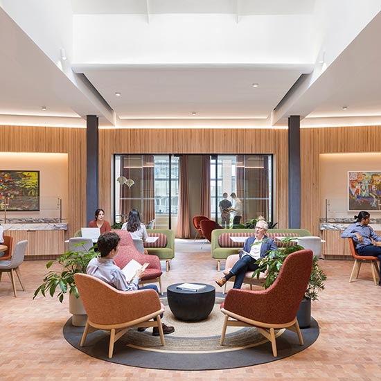 The renovation of a 17,000-SF penthouse office with a roof deck provides a new shared workplace for three distinct firms sharing common amenities such as a large conference center, library, coffee bar and dedicated independent development areas. 