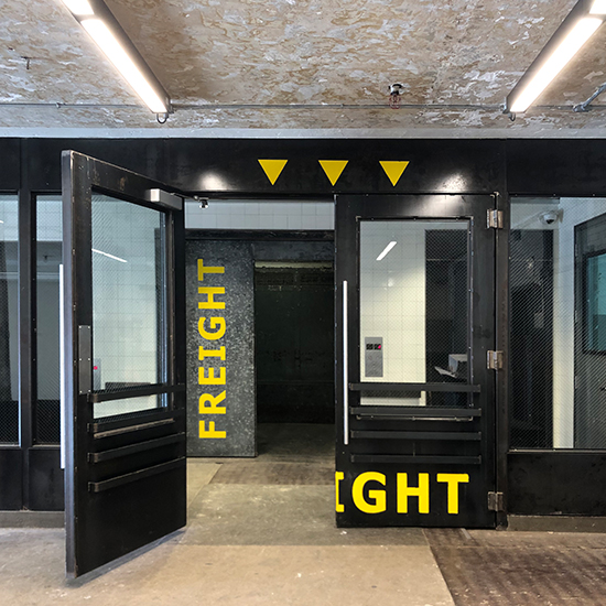 The renovation of this freight entry and loading dock near Hudson Yards creates a second pedestrian lobby and embraces the raw industrial character of the space.